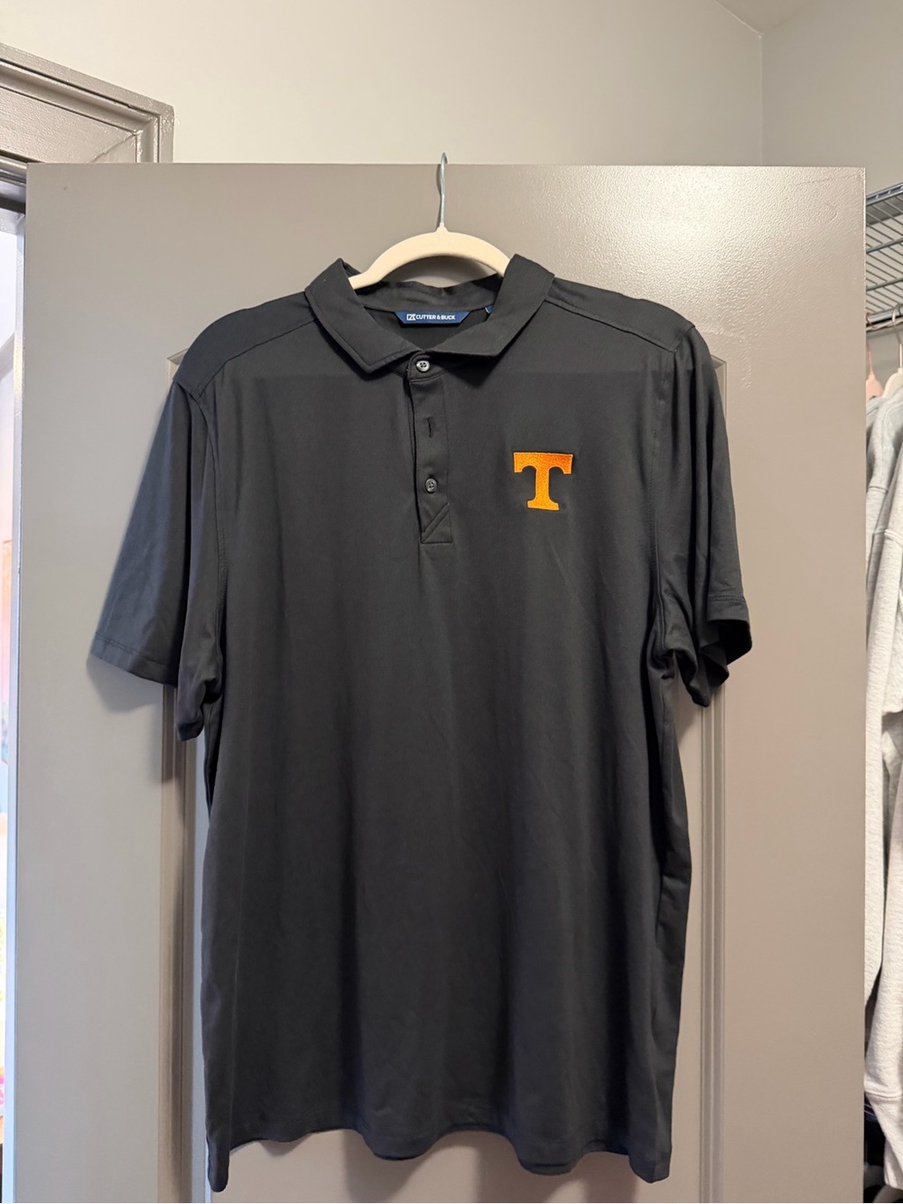 Cutter & Buck Black Polo with Orange 'T' Chest Logo